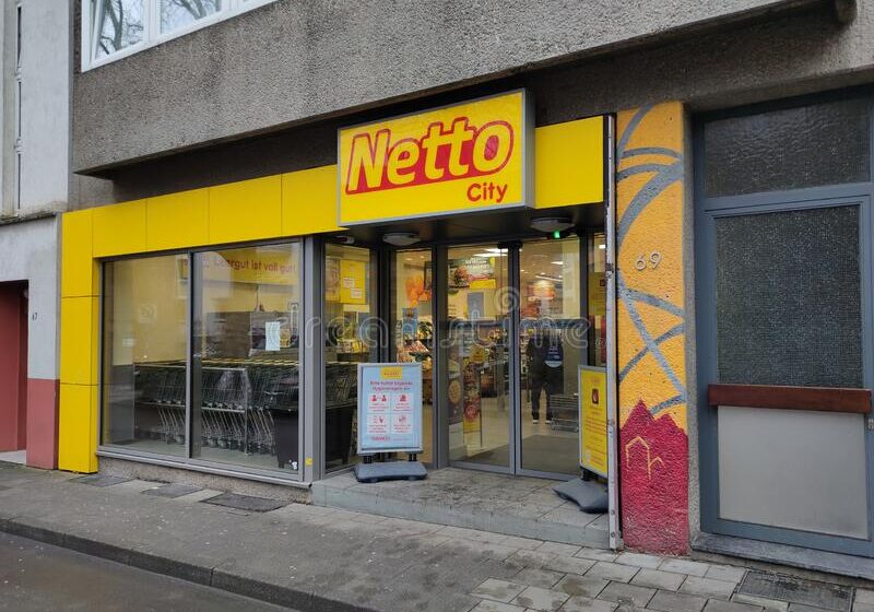 aachen-germany-january-logo-brand-name-netto-store-network-yellow-lettering-black-background-over-entrance-to-240750680